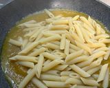 A picture of step 5 of Pennette with Pancetta, Yellow Cherry Tomato Sauce, and Pecorino (Fake Carbonara).