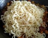 A picture of step 3 of "Schezwan Maggi with Baked Bread Bowl".