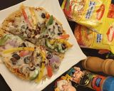 A picture of step 6 of Maggi Pizza.