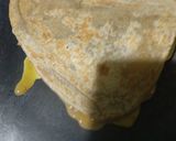 A picture of step 4 of Aanda parantha (egg parantha).