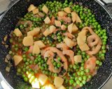 Foto del paso 4 de la receta: Guisantes con anillas de calamar