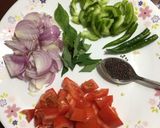 A picture of step 1 of Chatpata Bread Upma in red sauce.