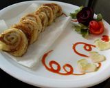 A picture of step 8 of Pin wheel bread sandwich.