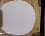 A picture of step 5 of Cheese burst pizza kadai baked.