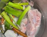 A picture of step 2 of Cook every part - Chicken broth (with some meat) from chicken back/carcass, and wing tips.