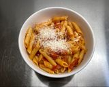 A picture of step 9 of Penne al'arrabiata (pasta with a spicy tomato sauce).