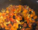 A picture of step 4 of Seared hake. Butterbean, chorizo and olive stew. Purple sprouting broccoli.