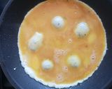 A picture of step 2 of Egg pizza on a pan.