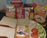 A picture of step 1 of 3 layered cheese sandwich.