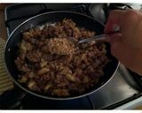 A picture of step 6 of AMIEs Eggplants Stuffed with Sausage.