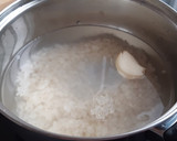 Foto del paso 1 de la receta: Ensalada de arroz con calamares a la americana en conserva
