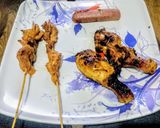 A picture of step 10 of Chicken paprika drums Skewered red hot Shrimps and grilled sausages.