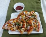 A picture of step 4 of Paneer tikka pizza.