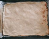 A picture of step 2 of Bacon Pizza.
