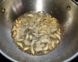 A picture of step 2 of Raw mango,garlic pickle.