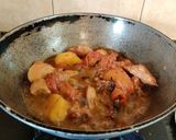 A picture of step 6 of Onion Tomato Chicken.