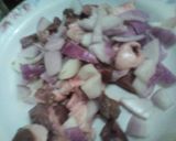 A picture of step 1 of Shinkafa da miyar koda.