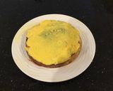 A picture of step 10 of Vanilla Layer Cake filled withLenon and Rasberry and frosted with Fresh Lemon Cream.