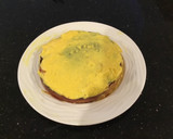 A picture of step 10 of Vanilla Layer Cake filled withLenon and Rasberry and frosted with Fresh Lemon Cream.