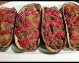 A picture of step 10 of AMIEs Eggplants Stuffed with Sausage.