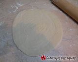 A picture of step 6 of Bouyiourdi in a dough bowl alla Conna.