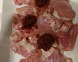 A picture of step 1 of Harissa chicken with olives and tomatoes.