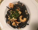 A picture of step 4 of Squid Ink Tagliolini with Grilled Shrimp, Mustard Pesto, and Toasted Pine Nuts.