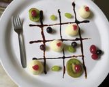 A picture of step 3 of Rasgulla with fruits.