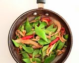 A picture of step 1 of Snow Peas with Caramelized Onions and Crispy Anchovies.