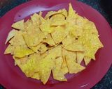 A picture of step 4 of Doritos (nachos chips) in cheese sauce.