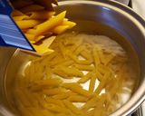 A picture of step 14 of Tuscan Chicken & Shrimp pasta.
