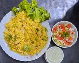 A picture of step 5 of Alu Biryani with kachumar salad.
