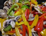 A picture of step 4 of Lemon Chicken with Colorful Peppers and Mushrooms.