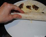 A picture of step 3 of Mashed dates and cheddar cheese wrapped in bread.