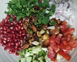 A picture of step 4 of Healthy Makhaana Salad with fruits veggies and nuts.
