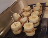 A picture of step 3 of Chocolate Covered Frozen Banana Peanut Butter Sandwiches.