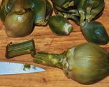 A picture of step 3 of Grilled Artichokes with Garlic, Oil, and Parsley Dressing.