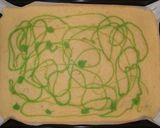 A picture of step 6 of Kiwi swiss roll cake.