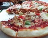 A picture of step 3 of Chicken Tikka Pizza 👅😋.