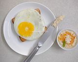 A picture of step 5 of Olive oil fried egg and hummus toast.