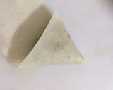 A picture of step 3 of Qeemay k Samosay (How to wrap samosa step by step).