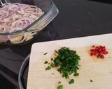 A picture of step 2 of Dover Sole in the oven with hot and crispy onion and potato on the side.