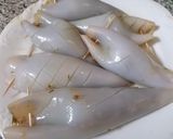 Foto del passaggio 5 della ricetta Calamari ripieni di melanzane su letto di pomodorini
