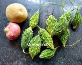 A picture of step 1 of Karela and Aloo Crispy Fry.