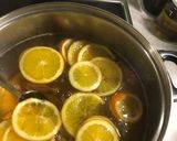 A picture of step 2 of Christmas cookies dipped in honey, aka melomakarona.
