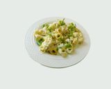 A picture of step 5 of Tortellini Pasta with white sauce.