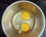A picture of step 2 of Italian cheese and herbs omelette.