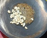 A picture of step 1 of Traditional Maharashtrian Thali. Amti,Chapati,Thecha, Bhendi,Dahi,Gud, Rice.