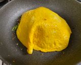 A picture of step 6 of Omu-Okonomiyaki (Japanese as-you-like pancake wrapped with egg).