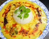 A picture of step 5 of Pakodi ki kadhi with plain rice.